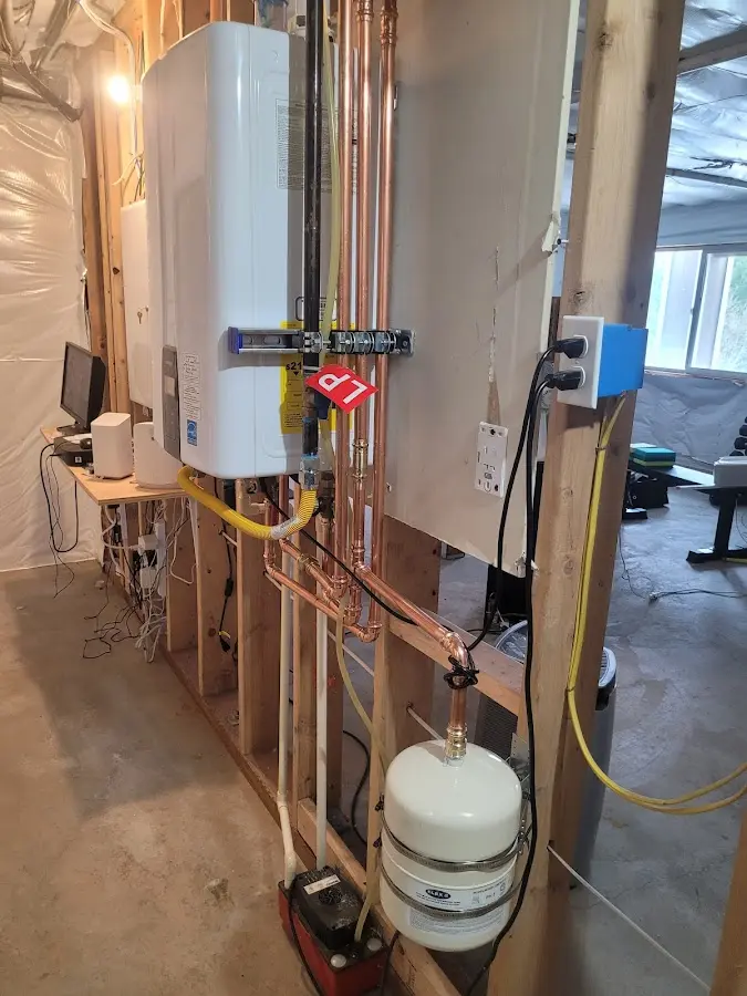 Licensed plumber repairing a kitchen sink in Ann Arbor